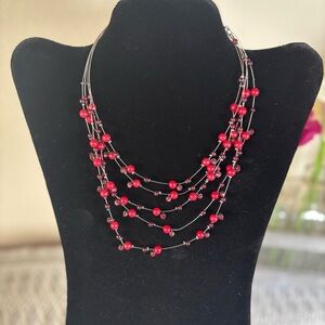 18” Red and silver toned beaded layered necklace.